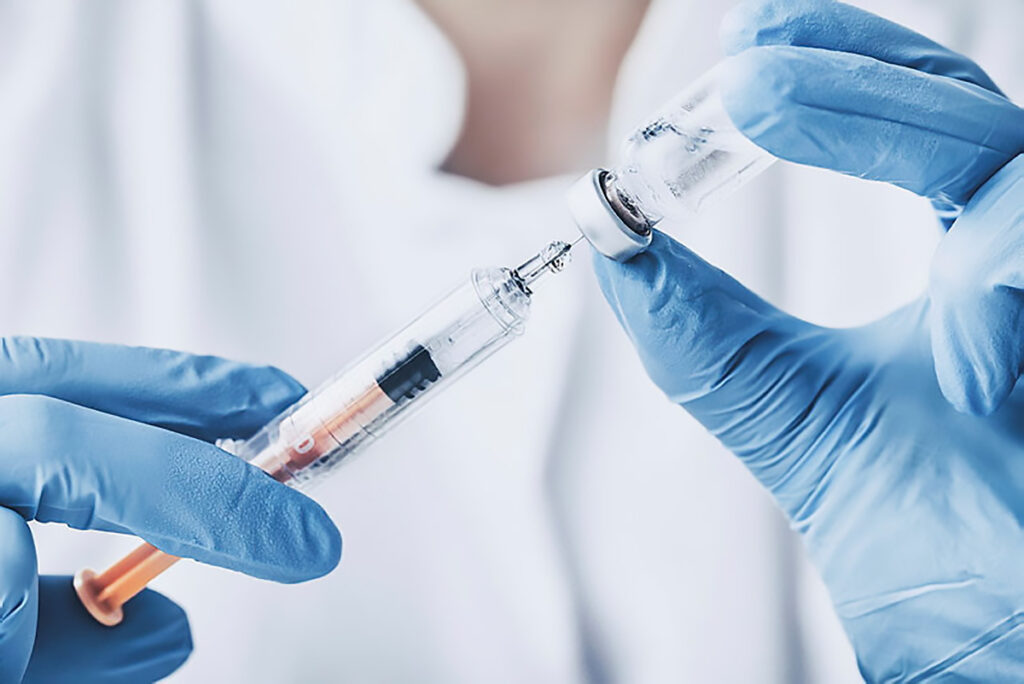 Injecting injection vaccine vaccination medicine flu woman doctor stock photo